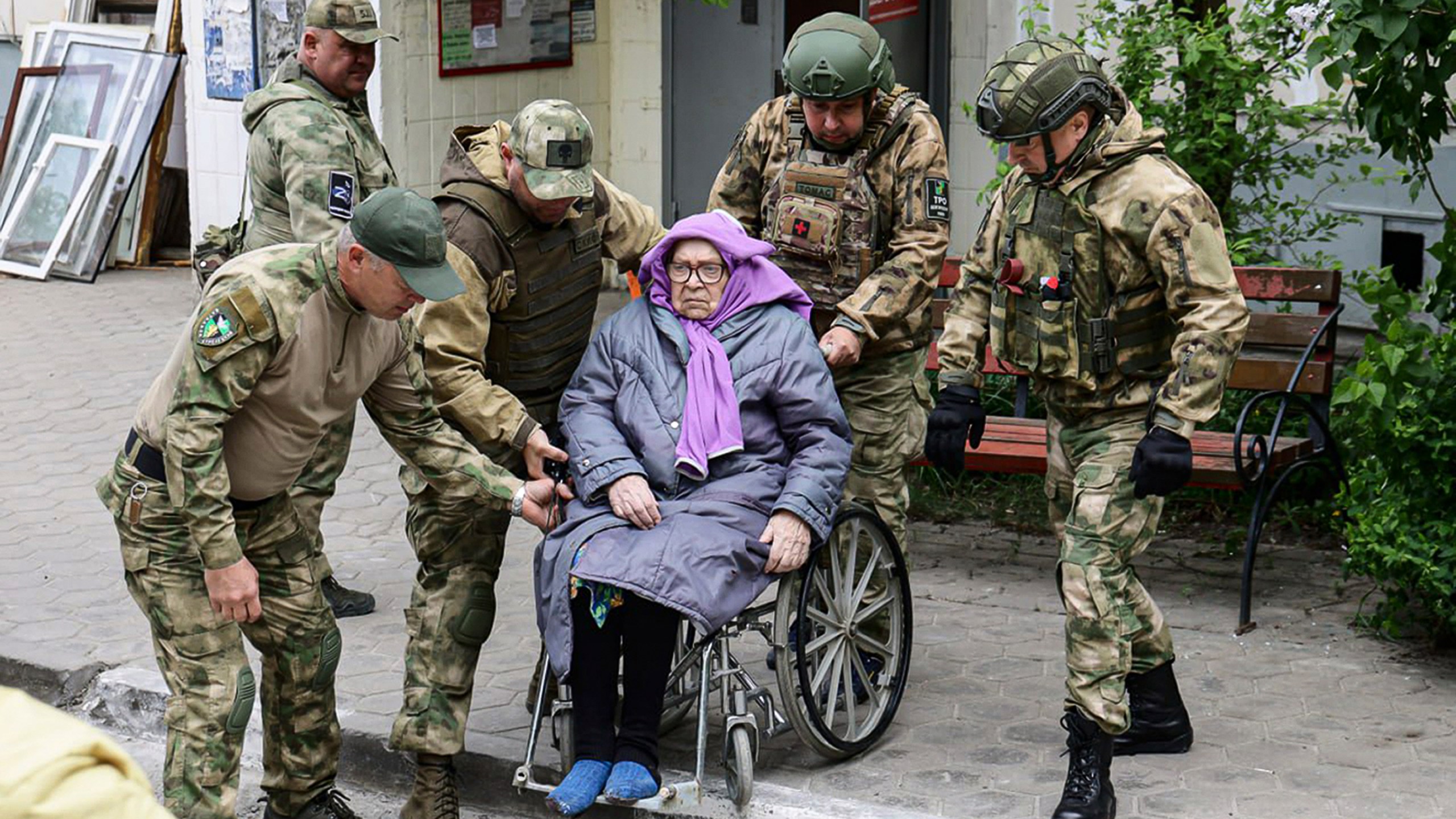 This photo released by Belgorod regional governor Vyacheslav Gladkov's Telegram channel on Sunday, May 12, 2024, volunteers help an elderly woman to leave an area of a partially collapsed block of flats after a missile attack by the Ukrainian Armed Forces in the Russian city of Belgorod, Russia.In a statement, Russia's Investigative Committee, the country's top law enforcement agency, said that the 10-story block had been hit by Ukrainian shelling. (Belgorod Region Governor Vyacheslav Gladkov Telegram channel via AP)