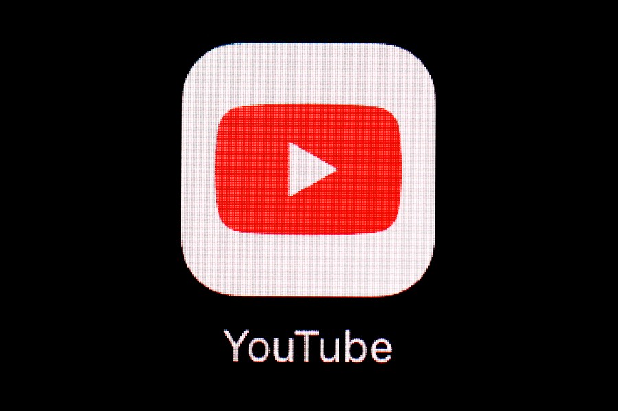 FILE - The YouTube app is displayed on an iPad in Baltimore. YouTube has blocked access to videos of a protest song in Hong Kong, days after court approved an injunction banning the song in the city. (AP Photo/Patrick Semansky, File)