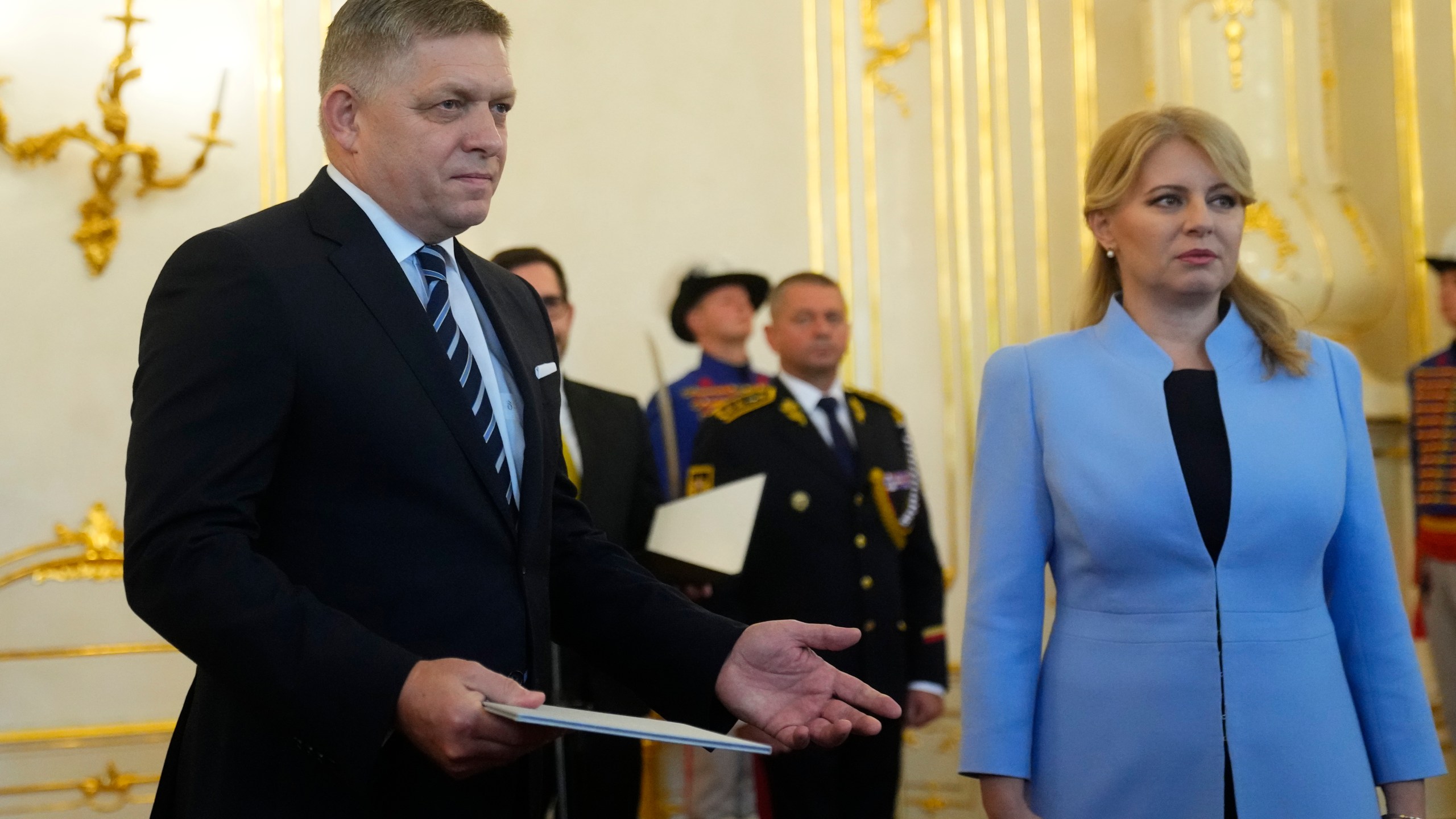 FILE - Slovakia's President Zuzana Caputova, right, and newly appointed Prime Minister Robert Fico pose for a photo during a swear in ceremony at the Presidential Palace in Bratislava, Slovakia, Wednesday, Oct. 25, 2023. Prime Minister Robert Fico returned to power in Slovakia last year. Having previously served twice as prime minister, from 2006 to 2010 and again from 2012 to 2018, the 59-year-old's third term made him the longest-serving head of government in Slovakia’s history. (AP Photo/Petr David Josek, File)