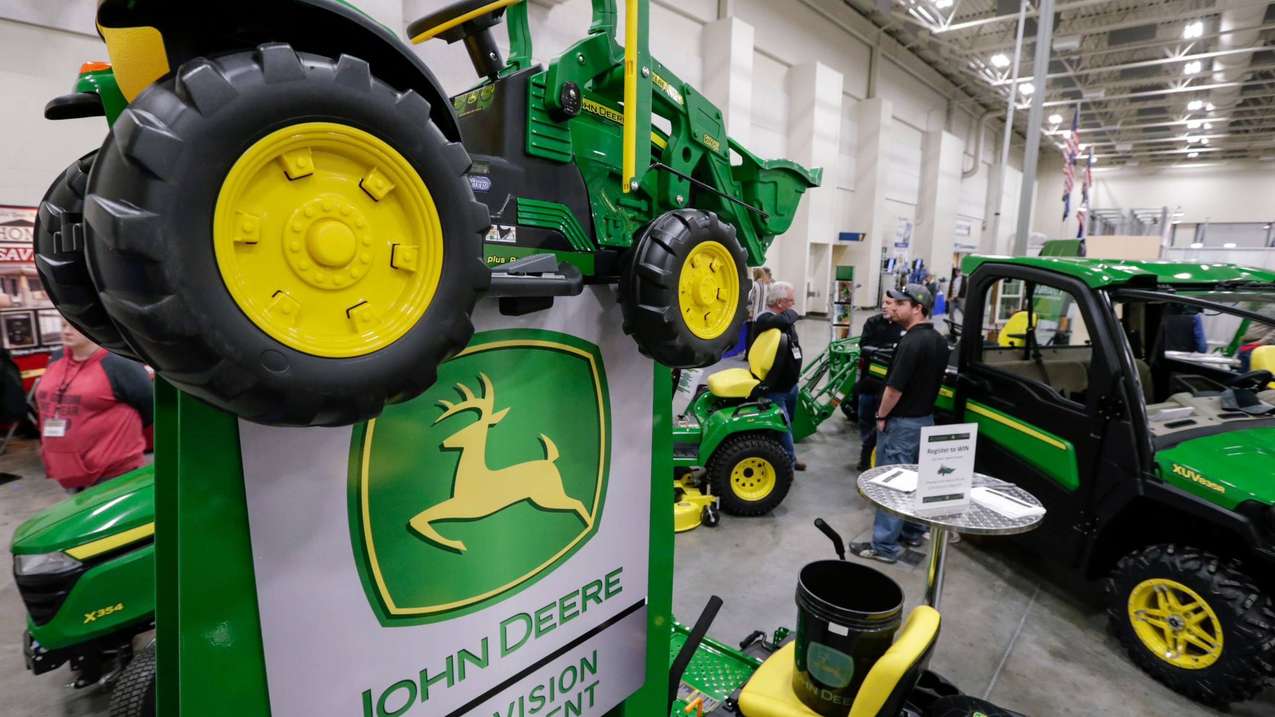 John Deere tractors on display for sale.