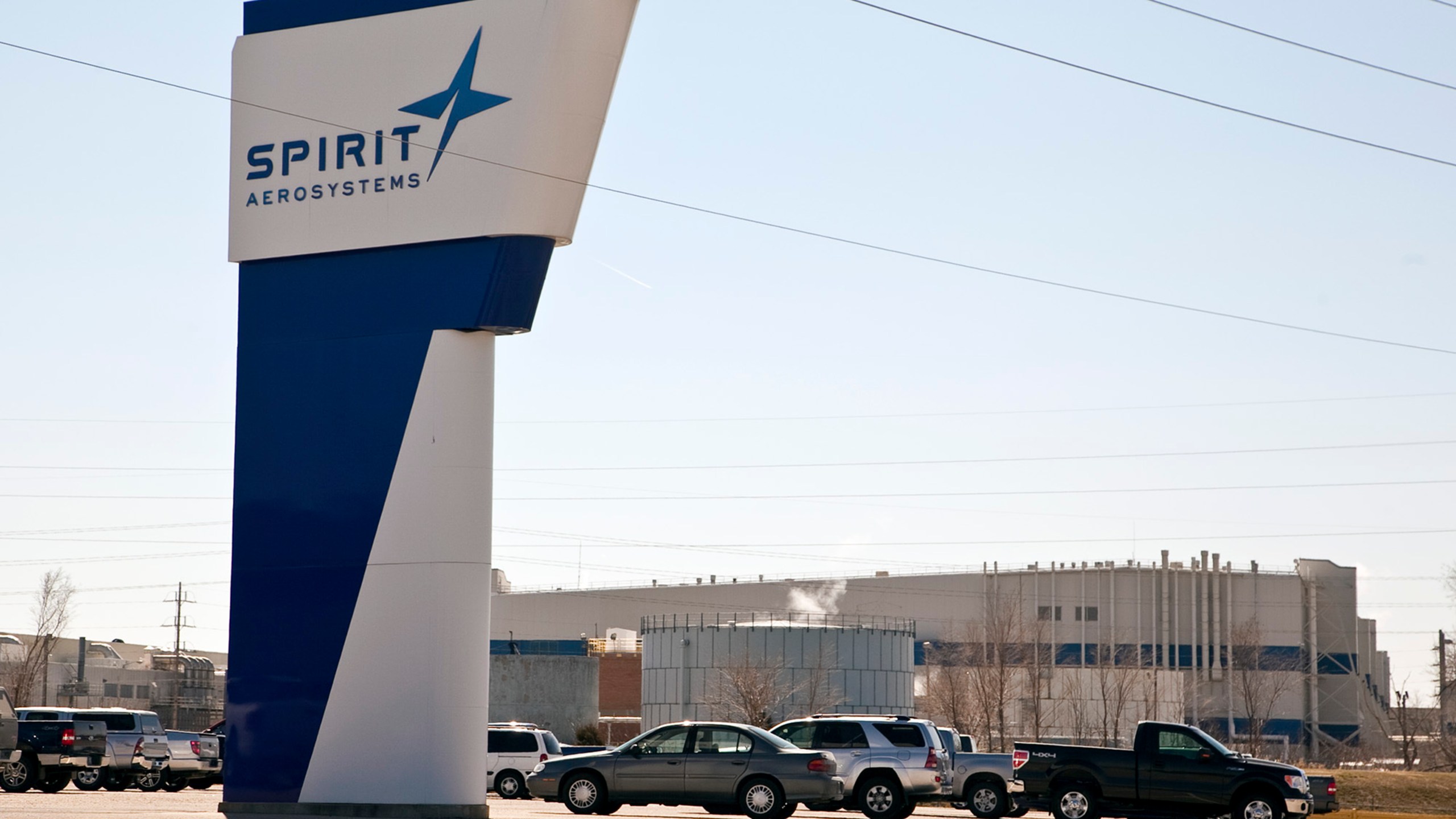 FILE - The Spirit AeroSystems sign is seen, July 25, 2013, in Wichita, Kan. The key Boeing supplier that makes the fuselages for its popular 737 Max airplanes confirmed Thursday, May 16, 2024, that it is laying off about 450 workers because production has slowed down ever since a panel flew off of one of those airplanes operated by Alaska Airlines in midair in January. (Mike Hutmacher/The Wichita Eagle via AP, File)