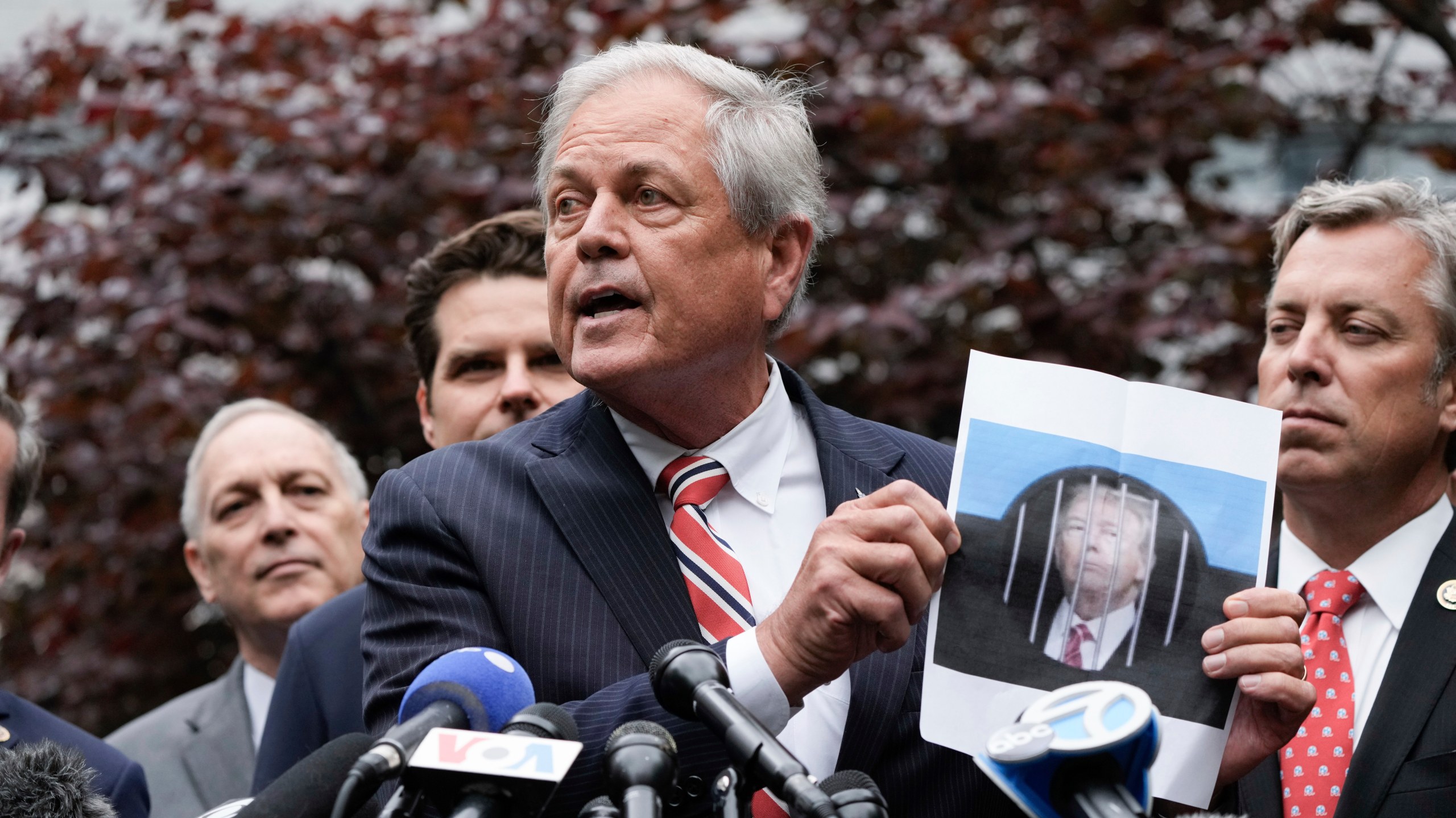 Rep. Ralph Norman, R-S.C., holds a photo of Former President Donald Trump as he speaks during a news conference at near Manhattan Criminal Court Thursday, May 16, 2024, in New York. Trump is accused of falsifying business records to cover up a sex scandal during the 2016 presidential campaign. (AP Photo/Frank Franklin II)