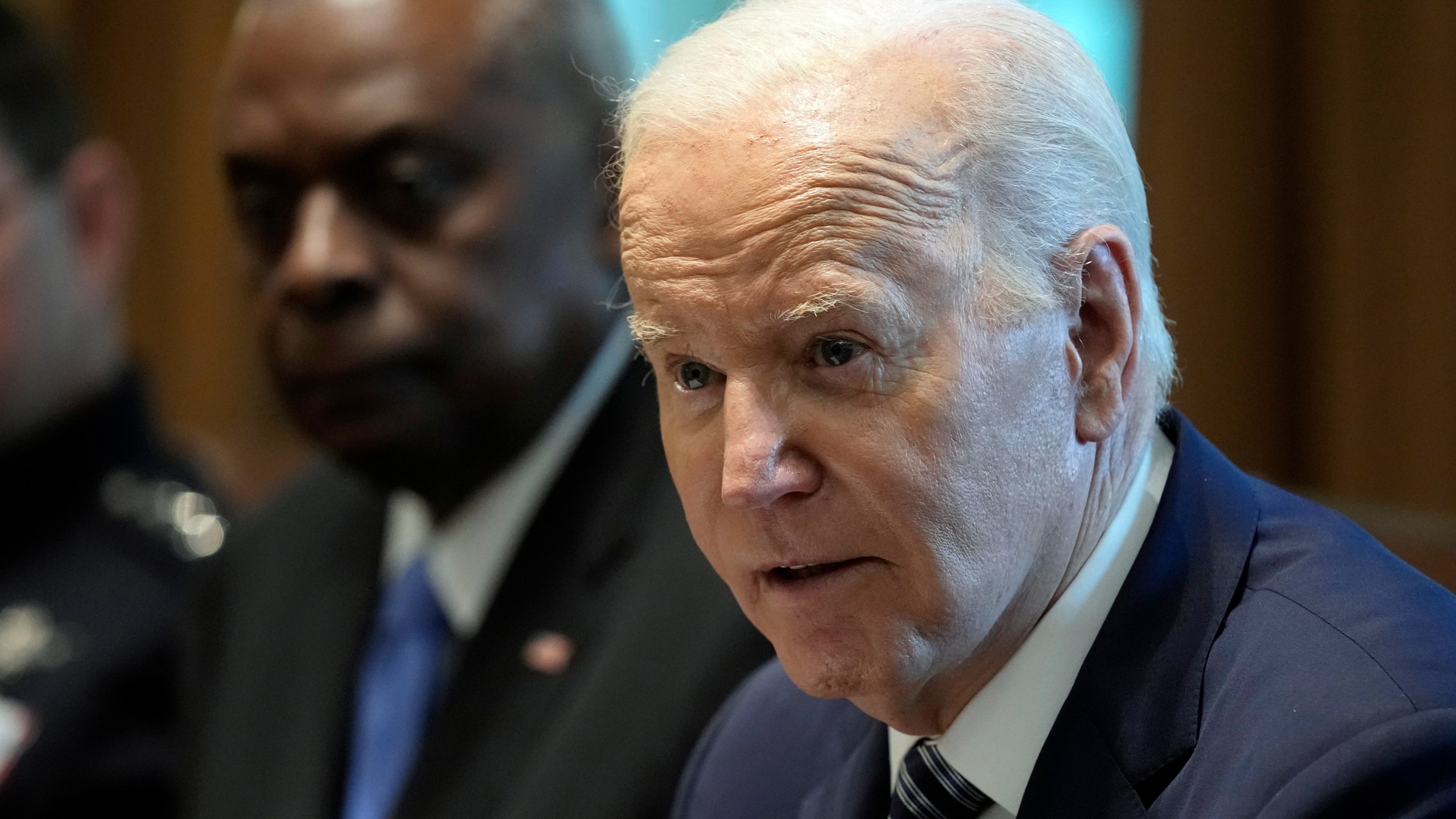 President Joe Biden, right, sitting next to Defense Secretary Lloyd Austin, left, speaks at the beginning of his meeting with the Combatant Commanders in the Cabinet Room of the White House in Washington, Wednesday, May 15, 2024, before hosting them for a dinner. (AP Photo/Susan Walsh)