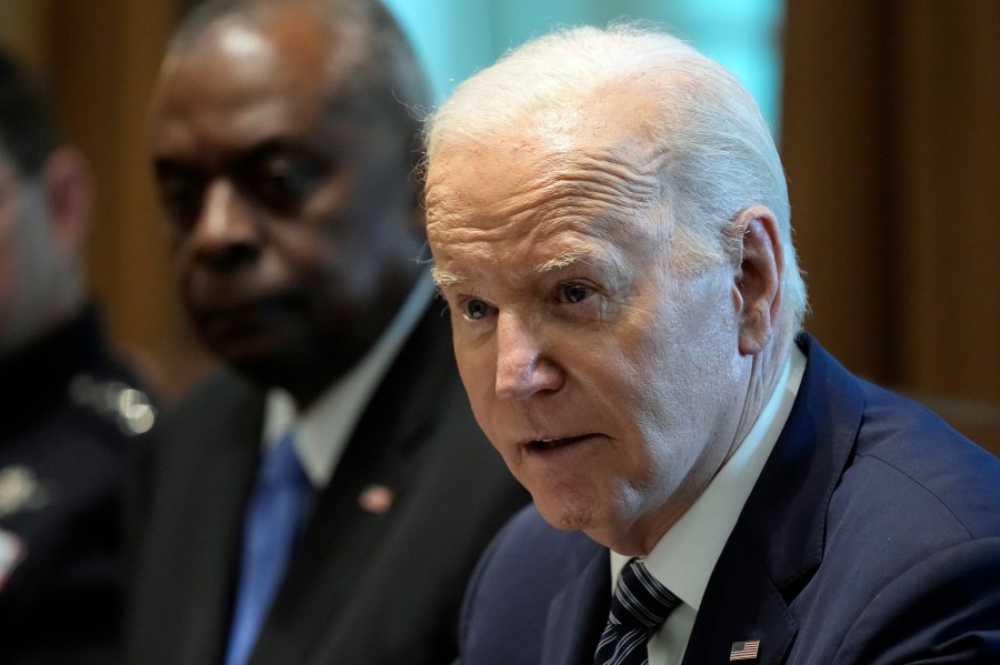 President Joe Biden, right, sitting next to Defense Secretary Lloyd Austin, left, speaks at the beginning of his meeting with the Combatant Commanders in the Cabinet Room of the White House in Washington, Wednesday, May 15, 2024, before hosting them for a dinner. (AP Photo/Susan Walsh)