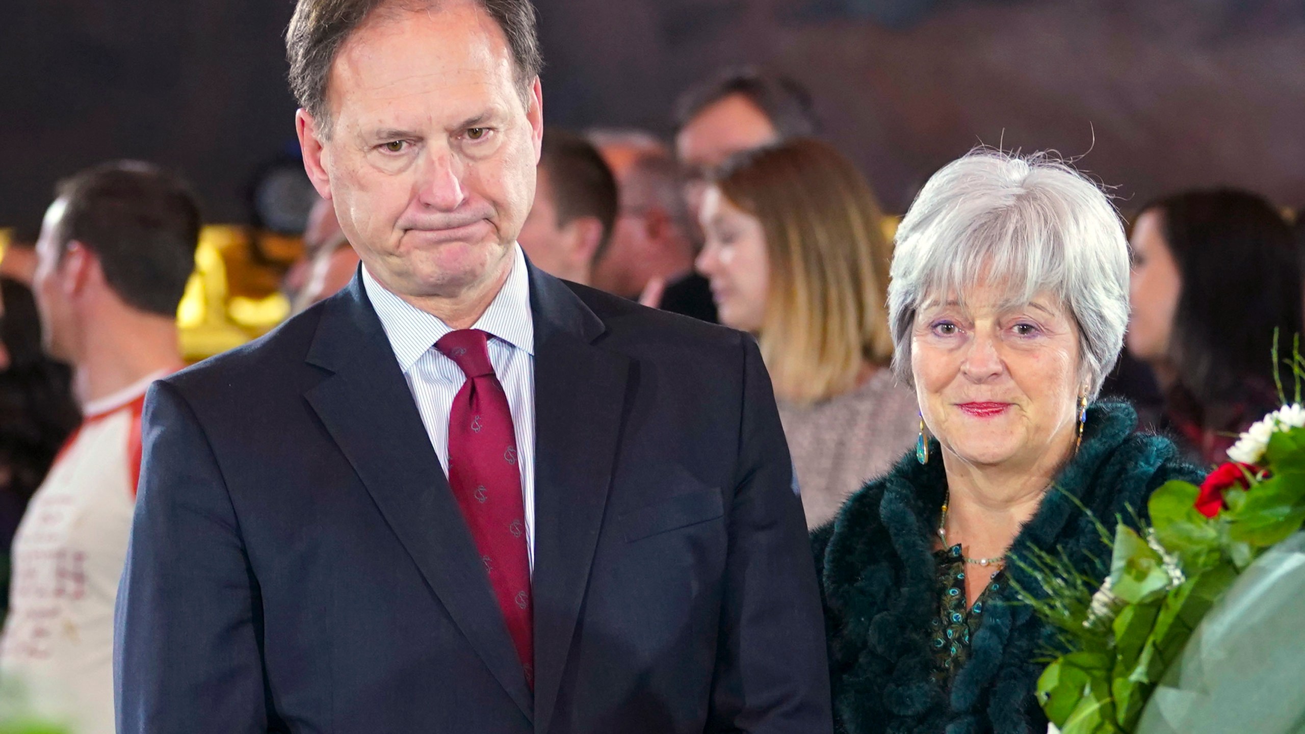 FILE - Supreme Court Justice Samuel Alito Jr., left, and his wife Martha-Ann Alito, pay their respects at the casket of Reverend Billy Graham at the Rotunda of the U.S. Capitol Building in Washington, Feb. 28, 2018. An upside-down American flag was displayed outside of Alito's home Jan. 17, 2021, days after former President Donald Trump supporters stormed the U.S. Capitol, The New York Times reports. It's a symbol associated with Trump's false claims of election fraud. "It was briefly placed by Mrs. Alito in response to a neighbor's use of objectionable and personally insulting language on yard signs," Alito said in an emailed statement to the newspaper. (AP Photo/Pablo Martinez Monsivais, File)