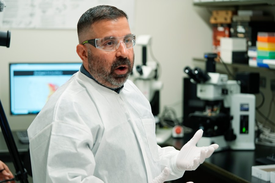 Researcher Erik Foster talks in his laboratory about ticks during a tour of the Center for Disease Control laboratory Thursday, April 4, 2024, in Fort Collins, Colo. (AP Photo/David Zalubowski)