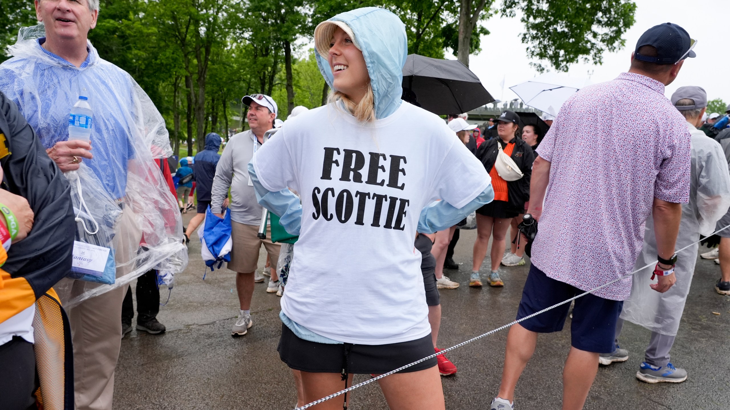 Emily Ferrando wears a T-shirt she bought in the parking lot in support of Scottie Scheffler during the second round of the PGA Championship golf tournament at the Valhalla Golf Club, Friday, May 17, 2024, in Louisville, Ky. (AP Photo/Matt York)