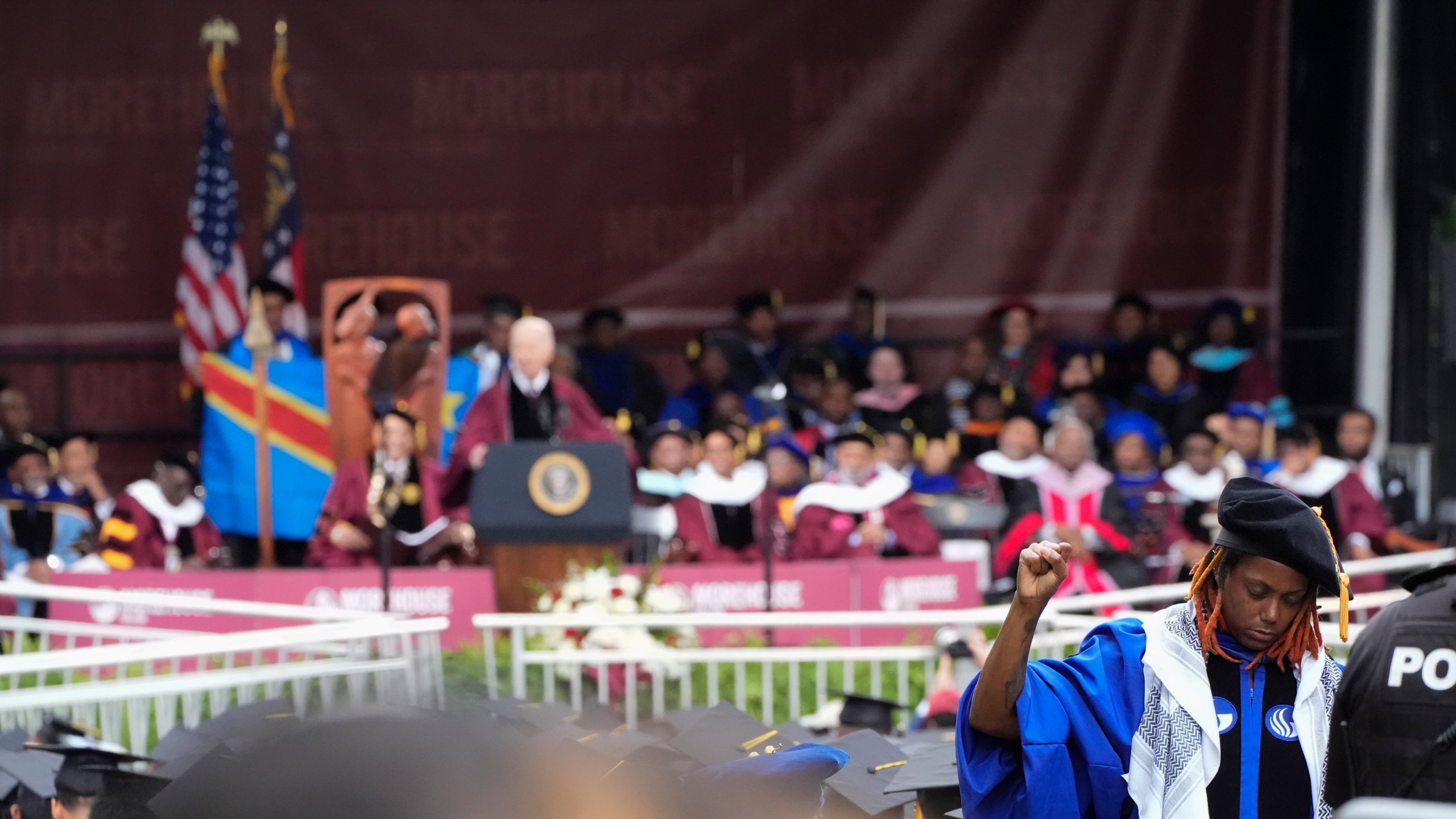 An attendee stands with their back to President Joe Biden as Biden speaks to graduating students at the Morehouse College commencement Sunday, May 19, 2024, in Atlanta. (AP Photo/John Bazemore)