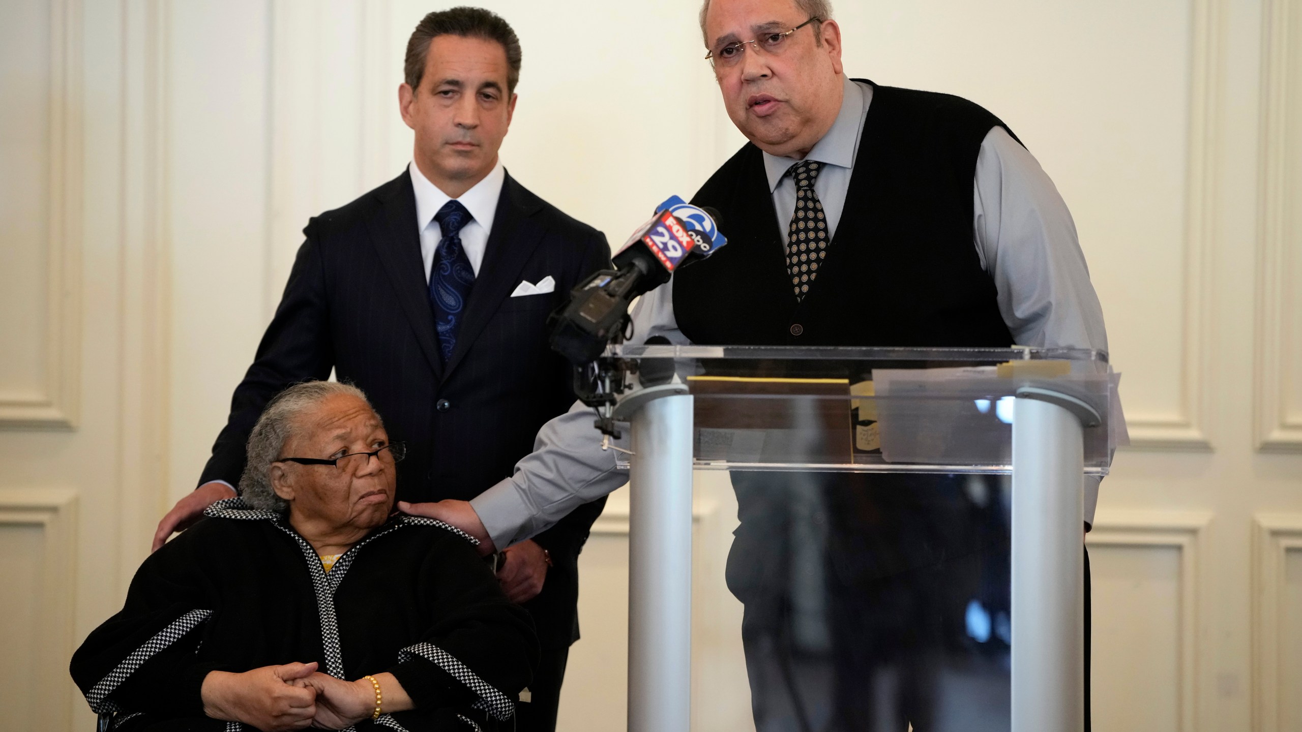 Sam Lemon, right, speaks during a news conference with Susie Williams Carter, center, and lawyer Michael Pomerantz, Monday, May 20, 2024, in Philadelphia. Carter is the sister of the youngest person ever executed in the state of Pennsylvania, Alexander McClay Williams, 16, and Lemon is the great-grandson of the attorney who represented him. Carter is suing the county where the Black teenager was convicted in 1931. The suit comes two years after Williams' conviction by an all-white jury was vacated. (AP Photo/Matt Slocum)