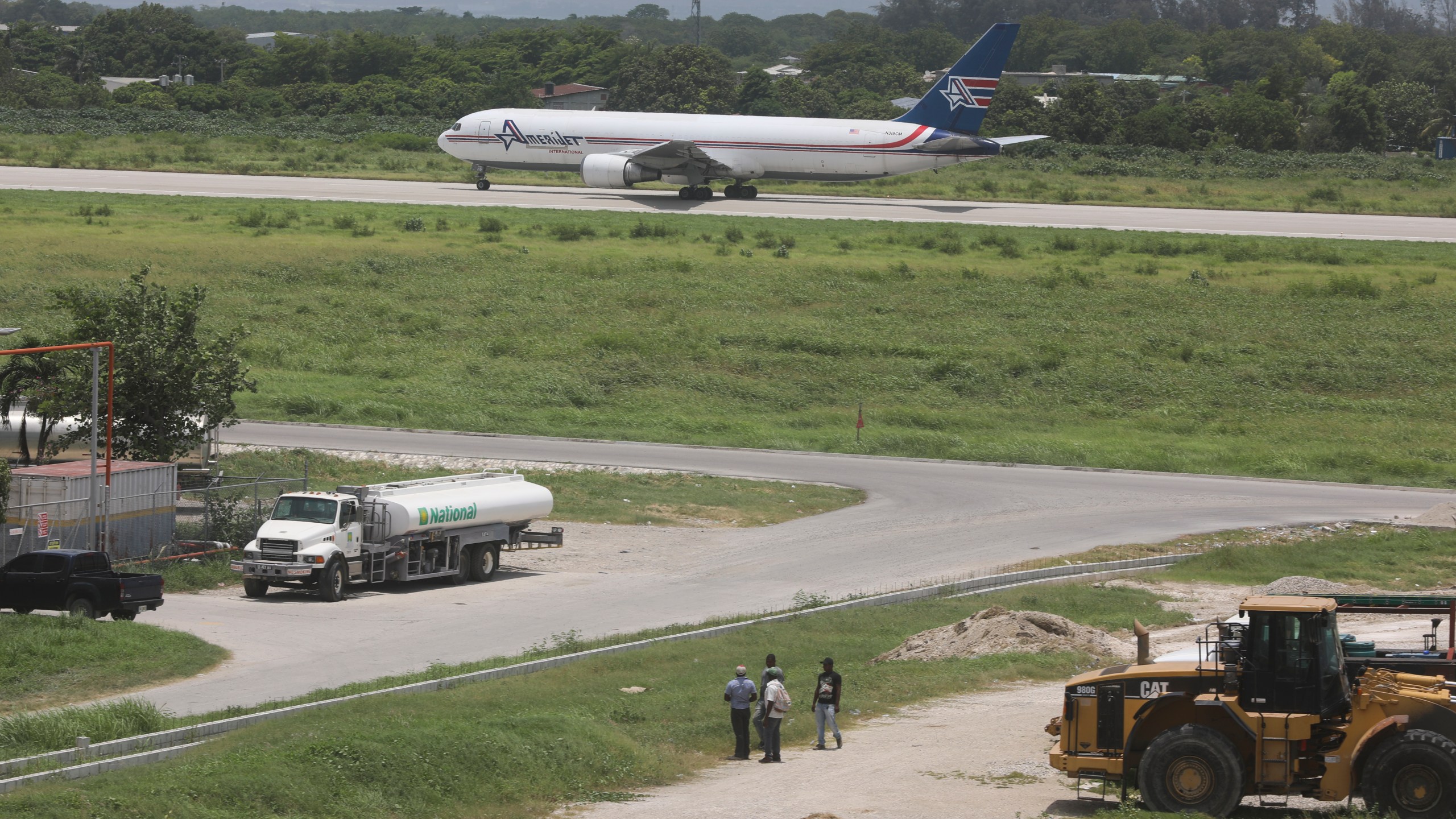 An Amerijet plane taxis on the runway after landing at the Toussaint Louverture International Airport in Port-au-Prince, Haiti, Monday, May 20, 2024. Haiti's main international airport reopened Monday for the first time in nearly three months after gang violence forced authorities to close it in early March. (AP Photo/Odelyn Joseph)