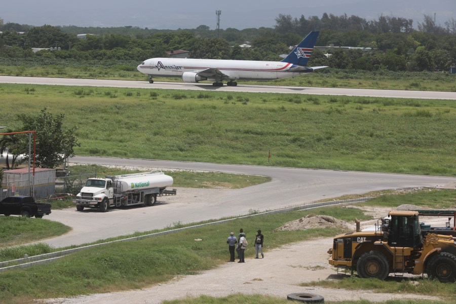 An Amerijet plane taxis on the runway after landing at the Toussaint Louverture International Airport in Port-au-Prince, Haiti, Monday, May 20, 2024. Haiti's main international airport reopened Monday for the first time in nearly three months after gang violence forced authorities to close it in early March. (AP Photo/Odelyn Joseph)