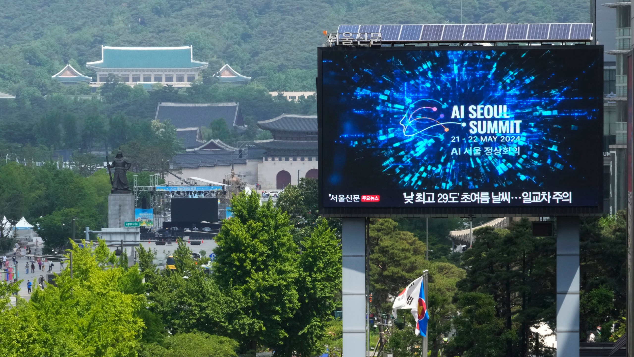 A screen shows an announcement of the AI Seoul Summit in Seoul, South Korea, Tuesday, May 21, 2024. World leaders are expected to adopt a new agreement on artificial intelligence when they gather virtually Tuesday to discuss AI’s potential risks but also ways to promote its benefits and innovation. (AP Photo/Ahn Young-joon)