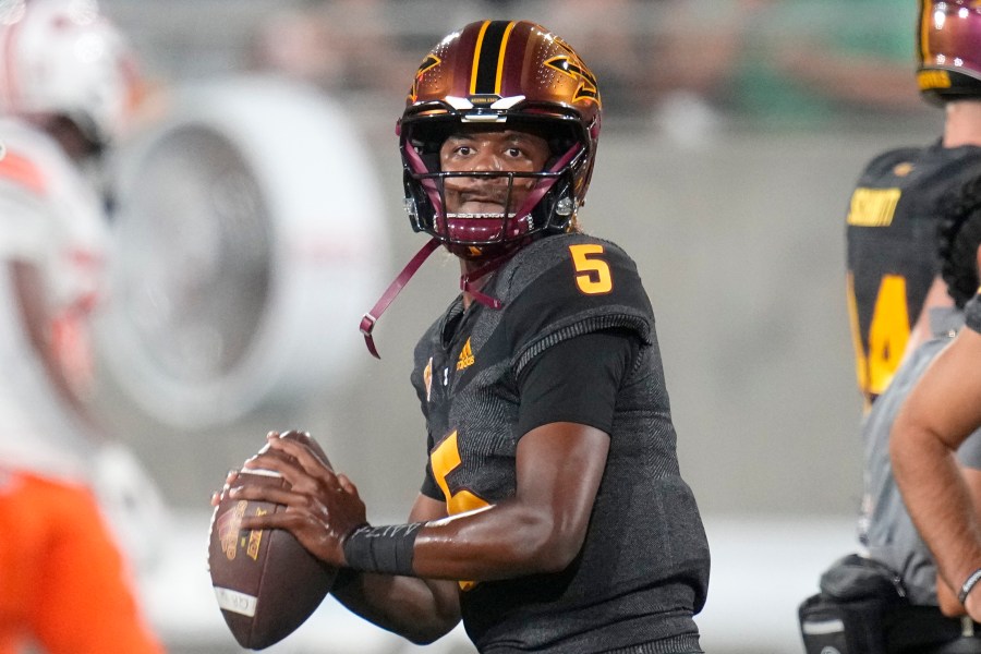 FILE -Arizona State quarterback Jaden Rashada warms up prior to an NCAA college football game against Oklahoma State Saturday, Sept. 9, 2023, in Tempe, Ariz. Former Florida recruit and current Georgia quarterback Jaden Rashada is suing Gators coach Billy Napier and the program’s top booster over a failed name, image and likeness deal worth nearly $14 million. The lawsuit filed Tuesday, May 21, 2024 in U.S. District Court in Pensacola, Fla. (AP Photo/Ross D. Franklin, File)