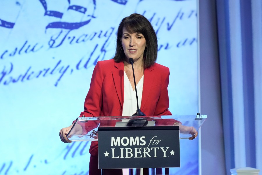 FILE - Moms for Liberty co-founder Tina Descovich speaks at the Moms for Liberty meeting in Philadelphia, June 30, 2023. The conservative parental rights group Moms for Liberty plans to spend more than $3 million on a multi-state advertising blitz to increase its membership and engage voters before November. (AP Photo/Matt Rourke)