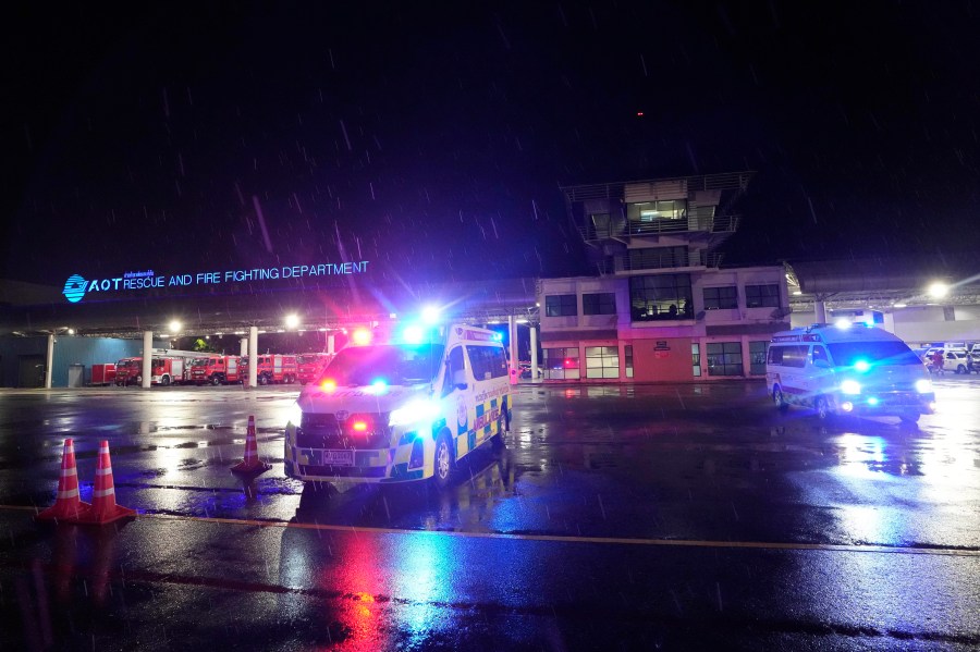 Ambulances are seen at the airport where a London-Singapore flight that encountered severe turbulence was diverted to, in Bangkok, Thailand, Tuesday, May 21, 2024. The plane apparently plummeted for a number of minutes before it was diverted to Bangkok, where emergency crews rushed to help injured passengers amid stormy weather, Singapore Airlines said Tuesday. (AP Photo/Sakchai Lalit)