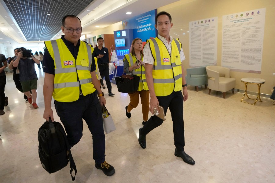 Staff members from the British Embassy arrive at Samitivej Srinakarin Hospital in Bangkok, Thailand, Wednesday, May 22, 2024, to visit passengers from Britain injured in the flight that hit severe turbulence over the Indian Ocean on Tuesday. The Singapore Airlines flight descended 6,000 feet (around 1,800 meters) in about three minutes, the carrier said Tuesday. A British man died and authorities said dozens of passengers were injured, some severely. (AP Photo/Sakchai Lalit)