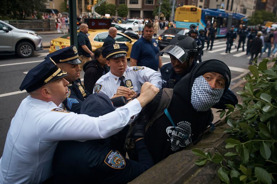 FILE - Police arrest a pro-Palestinian protester near the Metropolitan Museum of Art, where the Met Gala takes place, May 6, 2024, in New York. Some civil liberties attorneys are questioning New York City Mayor Eric Adams' commitment to overhauling how police respond to protests in the wake of the NYPD’s aggressive response to a pro-Palestinian demonstration on Saturday, May 18, where officers were filmed pummeling a man on the ground and holding another protester by the throat. (AP Photo/Andres Kudacki, File)