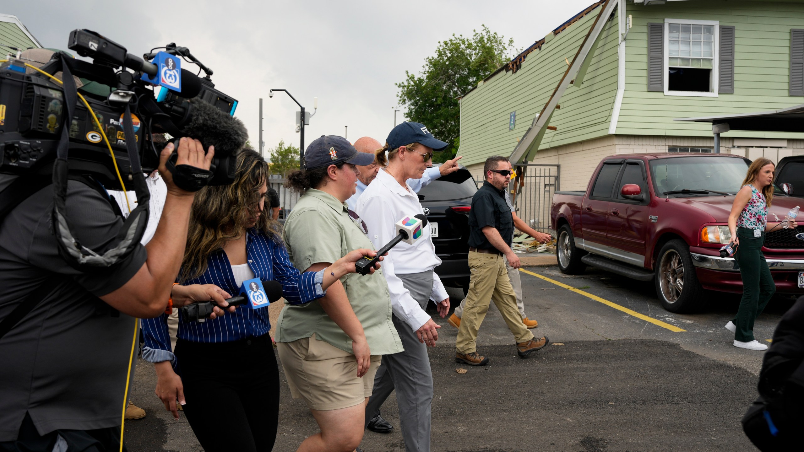 FEMA Administrator Deanne Criswell, center, visits an apartment complex damaged by severe storms at Spring Branch in Houston, Tuesday, May 21, 2024. (Yi-Chin Lee/Houston Chronicle via AP)