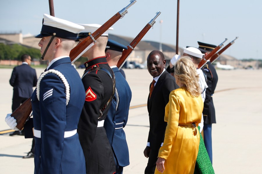 Kenya's President William Ruto, center, and first Lady Jill Biden, right, talk during an arrival ceremony at Andrews Air Force Base, Md., Wednesday, May 22, 2024, during President Ruto's state visit to the United States. (AP Photo/Luis M. Alvarez)