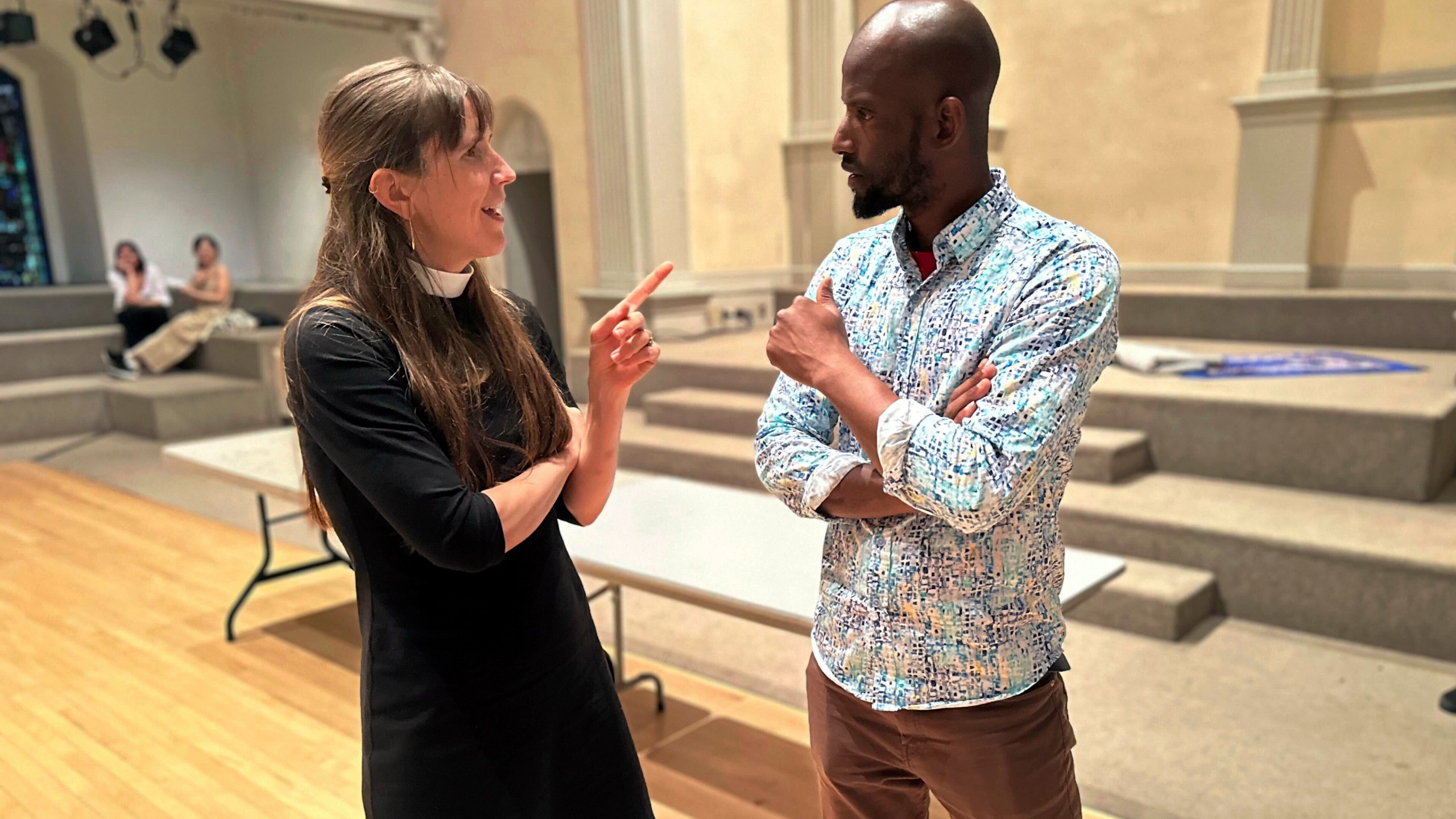 Mamadou Diallo, 39, of Senegal, speaks with Rev. Anne Marie Witchger at St. Mark's Church-in-the-Bowery, Wednesday, May 22, 2024, a lower Manhattan Episcopal church that operates a "welcome center" for migrants on Wednesdays. (AP Photo/Philip Marcelo)