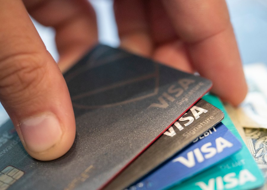 FILE - Visa credit cards in New Orleans, Aug. 11, 2019. Consumers are increasingly struggling to pay their credit card bills, raising concerns about severe delinquencies spiraling and sapping consumer spending. (AP Photo/Jenny Kane, File)