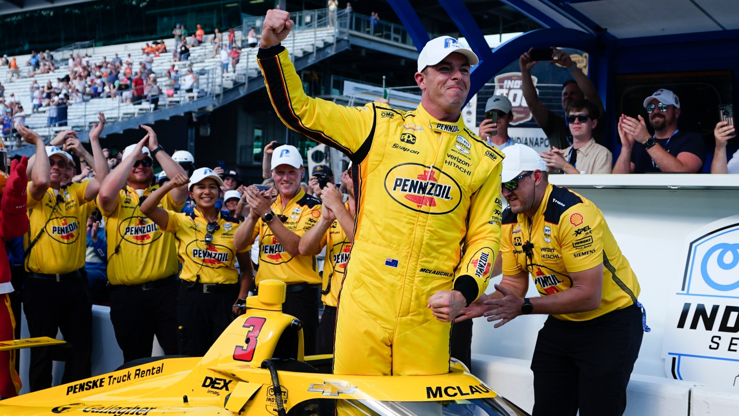 Scott McLaughlin, front, of New Zealand, celebrates after winning the pole for the Indianapolis 500 auto race at Indianapolis Motor Speedway, Sunday, May 19, 2024, in Indianapolis. (AP Photo/Darron Cummings)