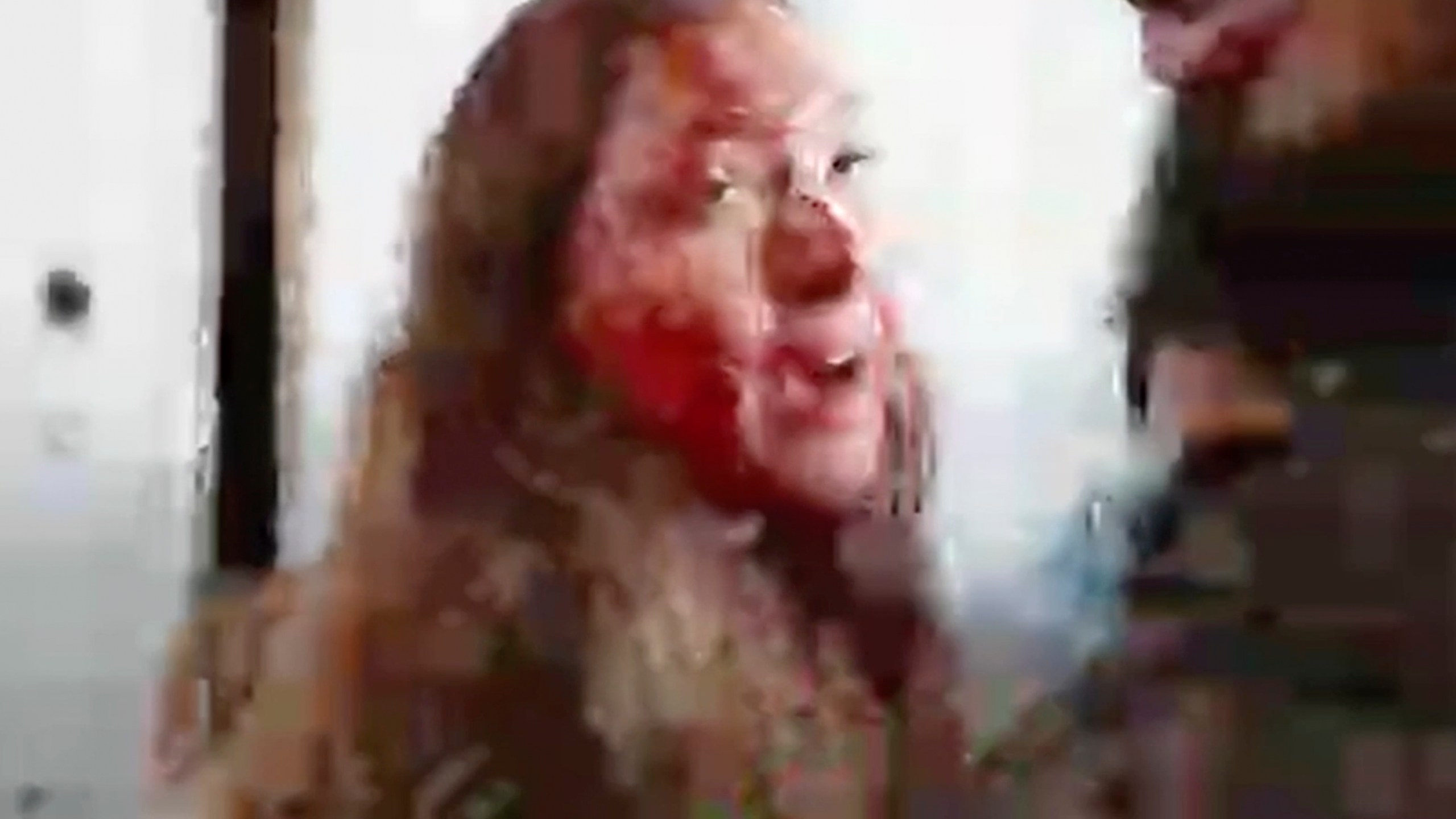 This image taken from video provided by the Hostage Families Forum, shows a bloodied Israeli female soldier from the Nahal Oz military base after she was taken captive by Hamas on Oct. 7, 2023. The footage was taken by Hamas militants who stormed the Nahal Oz military base, part of the militant group’s wider assault on southern Israel that killed roughly 1,200 people and took about 250 others hostage. (Hostage Families Forum via AP)