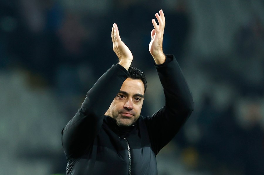 FILE - Barcelona's head coach Xavi Hernandez celebrates after the Spanish La Liga soccer match between Barcelona and Atletico Madrid at the Olimpic Lluis Companys stadium in Barcelona, Spain, on Dec. 3, 2023. Barcelona says coach Xavi Hernandez is leaving the club at the end of the season. The Spanish club made the announcement Friday May 24, 2024 after a meeting between club president Joan Laporta, Xavi and several other senior figures at the team's training ground. (AP Photo/Joan Monfort, File)