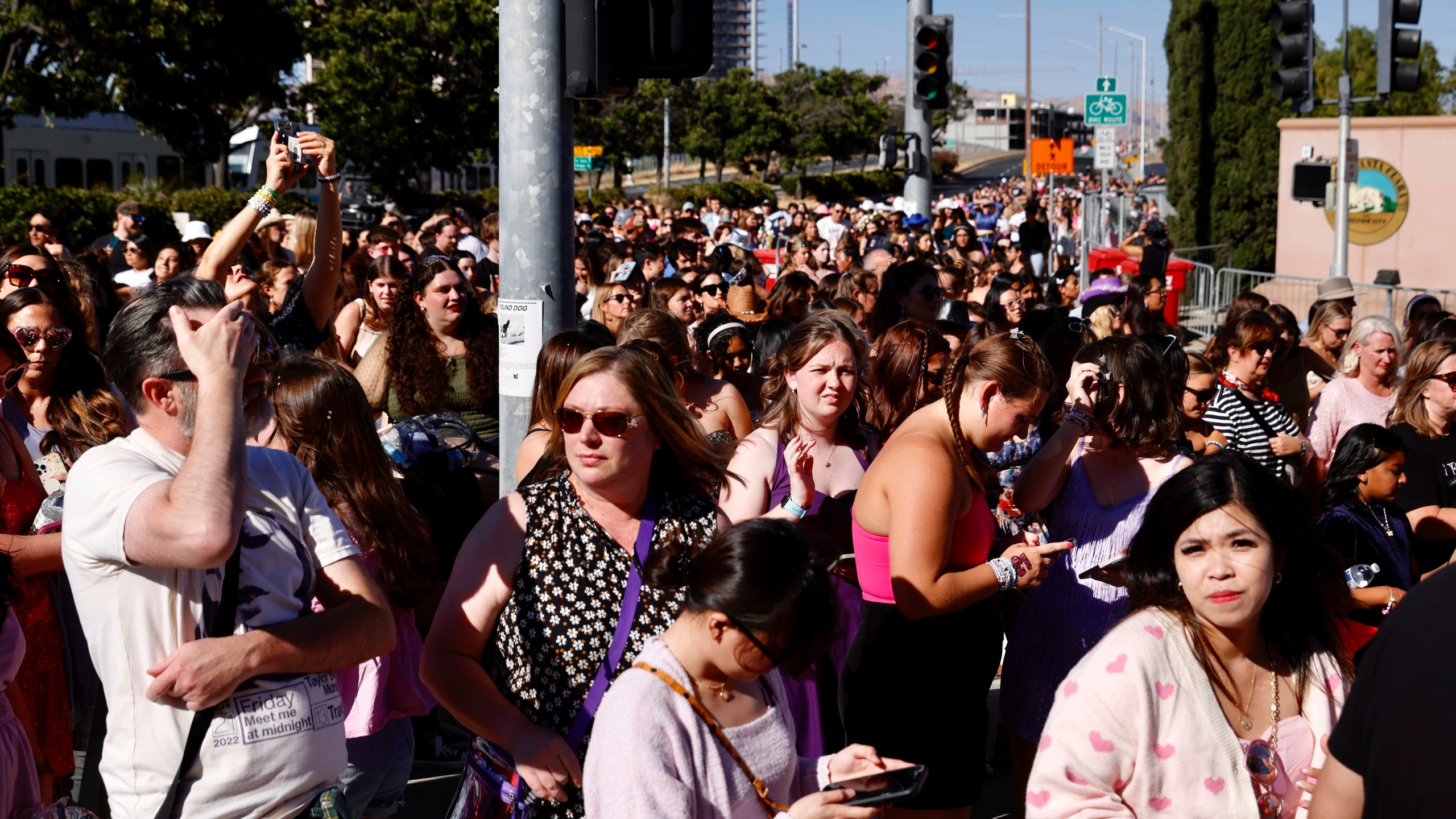 FILE - Fans wait to go through security before Taylor Swift performs at Levi's Stadium in Santa Clara, Calif. on July 28, 2023. The 2022 fiasco after there were a myriad of problems with fans trying to buy tickets for Swift's massive "Eras" tour shone a light on cracks in the ticketing system. (Jessica Christian/San Francisco Chronicle via AP, File)