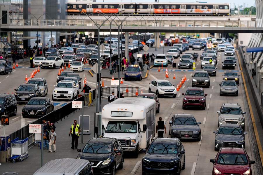 Cars drive through Hartsfield-Jackson Atlanta International Airport ahead of Memorial Day, Friday, May 24, 2024, in Atlanta (AP Photo/Mike Stewart)