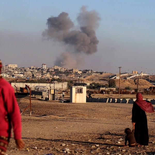 FILE - Smoke rises following an Israeli airstrike on buildings near the separating wall between Egypt and Rafah, southern Gaza Strip, Tuesday, May 7, 2024. An order by the top United Nations court for Israel to halt its military offensive in the southern Gaza city of Rafah deepens its disconnect with the United States. (AP Photo/Ramez Habboub, File)