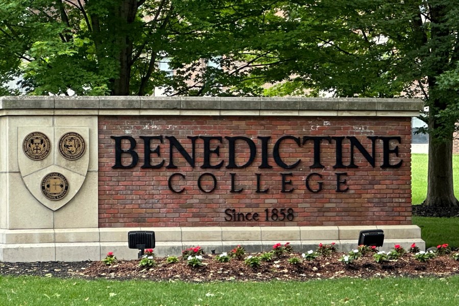 The Benedictine College sign is seen Wednesday, May 15, 2024, in Atchison, Kan., days after Kansas City Chiefs kicker Harrison Butker gave a commencement speech that has been gaining attention. Butker's speech has raised some eyebrows with his proclamations of conservative politics and Catholicism, but he received a standing ovation from graduates and other attendees of the commencement ceremony on Saturday, May 11. (AP Photo/Nick Ingram)