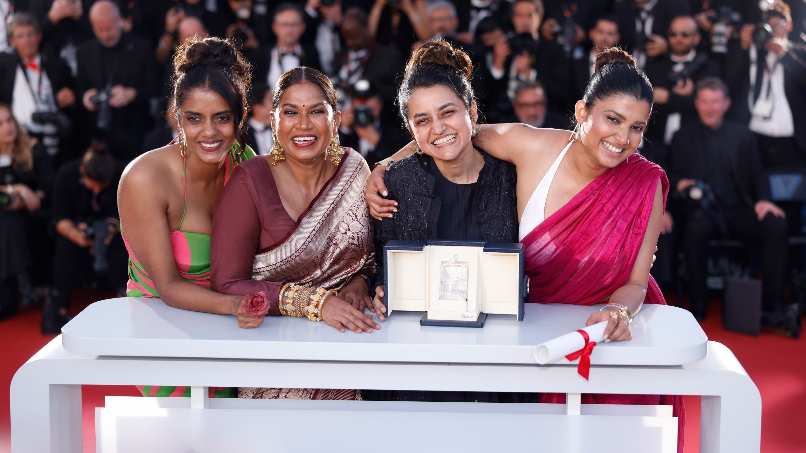 Payal Kapadia, second from right, winner of the grand prize for 'All We Imagine as Light,' poses with Kani Kusruti, from left, Chhaya Kadam, and Divya Prabha during the photo call following the awards ceremony at the 77th international film festival, Cannes, southern France, Saturday, May 25, 2024. (Photo by Vianney Le Caer/Invision/AP)