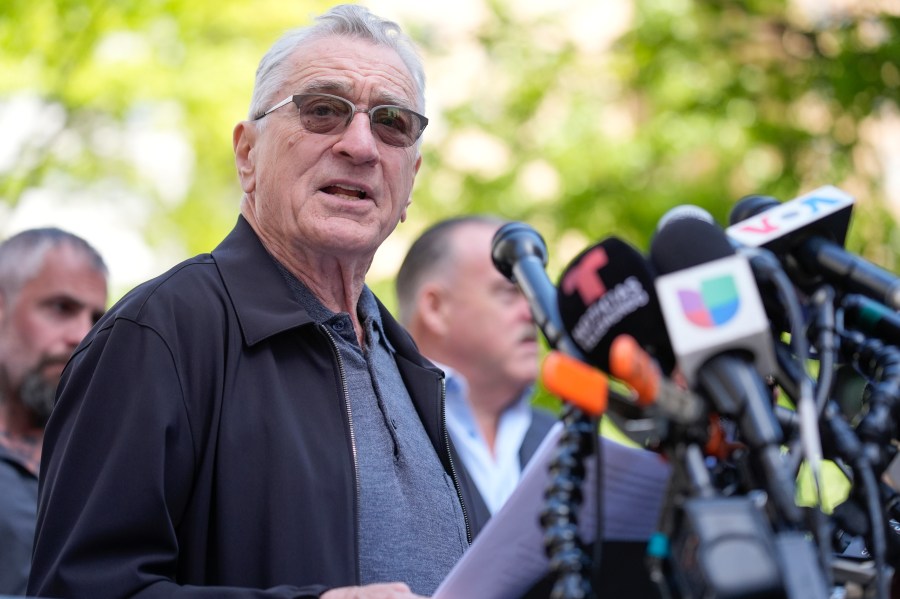 Robert De Niro speaks to reporters in support of President Joe Biden across the street from former President Donald Trump's criminal trial in New York, Tuesday, May 28, 2024. (AP Photo/Seth Wenig)