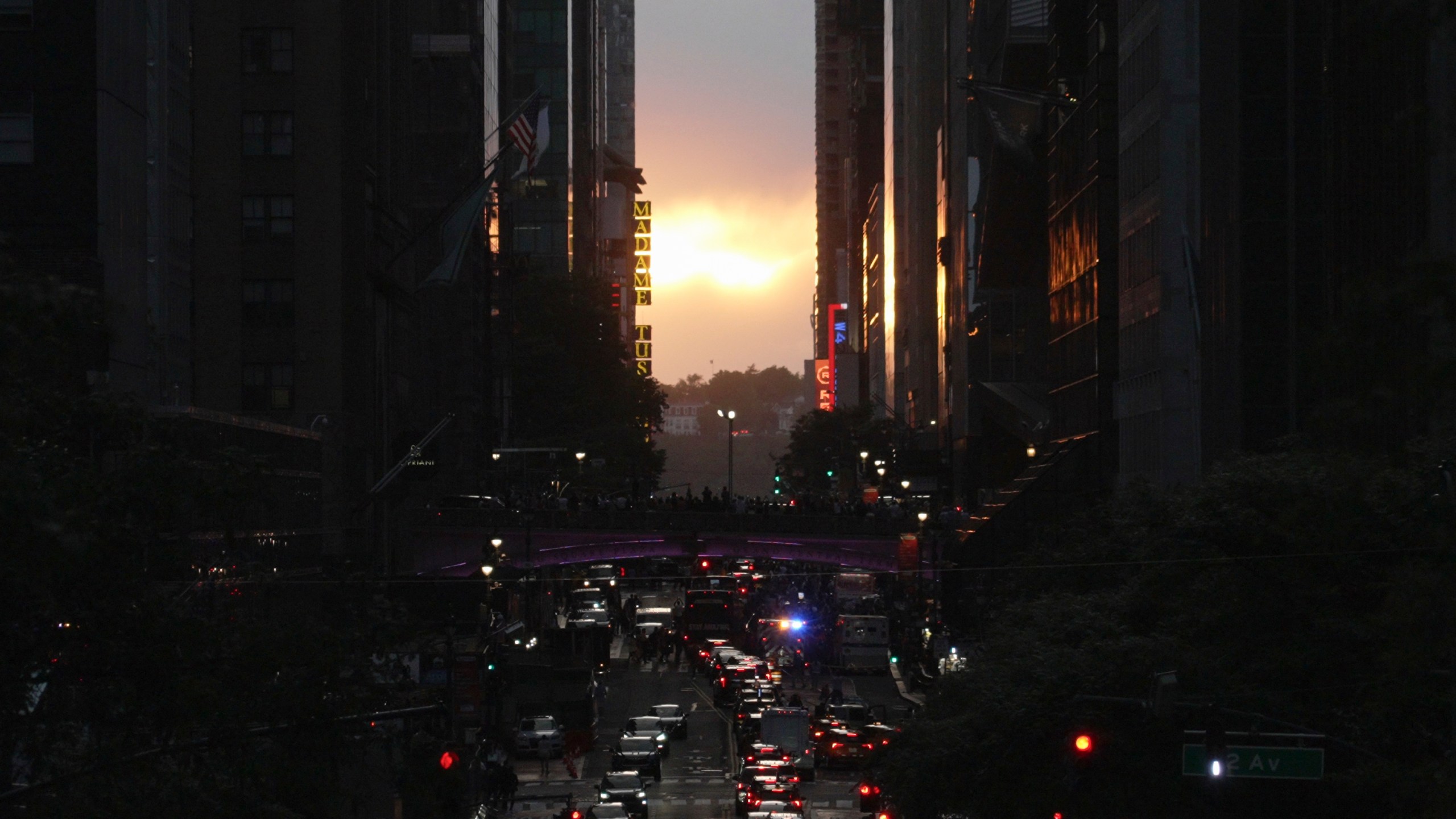 Clouds obscure the view of the setting sun on 42nd street in New York, Tuesday, May 28, 2024. Twice per year, New Yorkers and visitors are treated to a phenomenon known as Manhattanhenge, when the setting sun aligns with the Manhattan street grid and sinks below the horizon framed in a canyon of skyscrapers. (AP Photo/Mary Conlon)