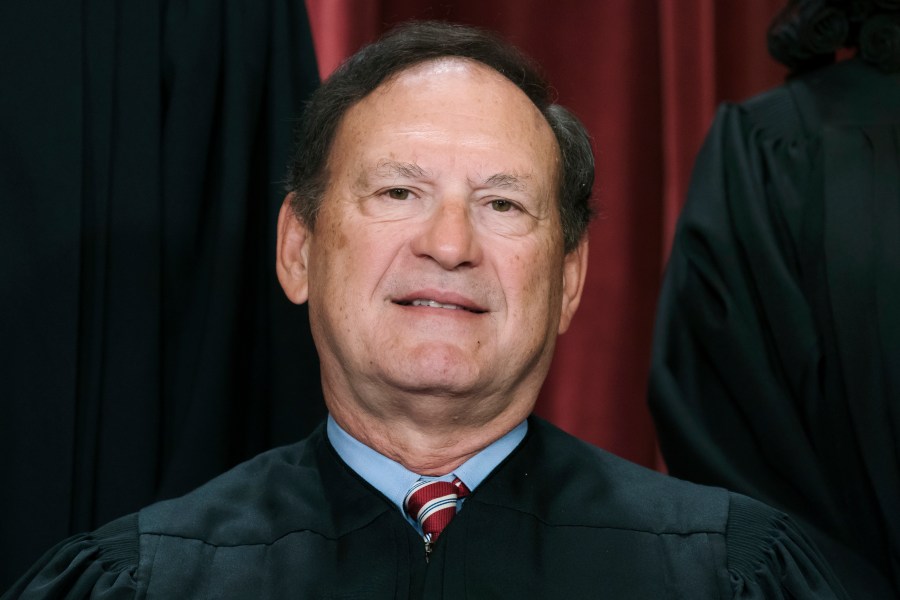 FILE - Associate Justice Samuel Alito joins other members of the Supreme Court as they pose for a new group portrait, Oct. 7, 2022, at the Supreme Court building in Washington. Alito rejects calls to step aside from Supreme Court cases on Trump and Jan. 6. (AP Photo/J. Scott Applewhite, File)