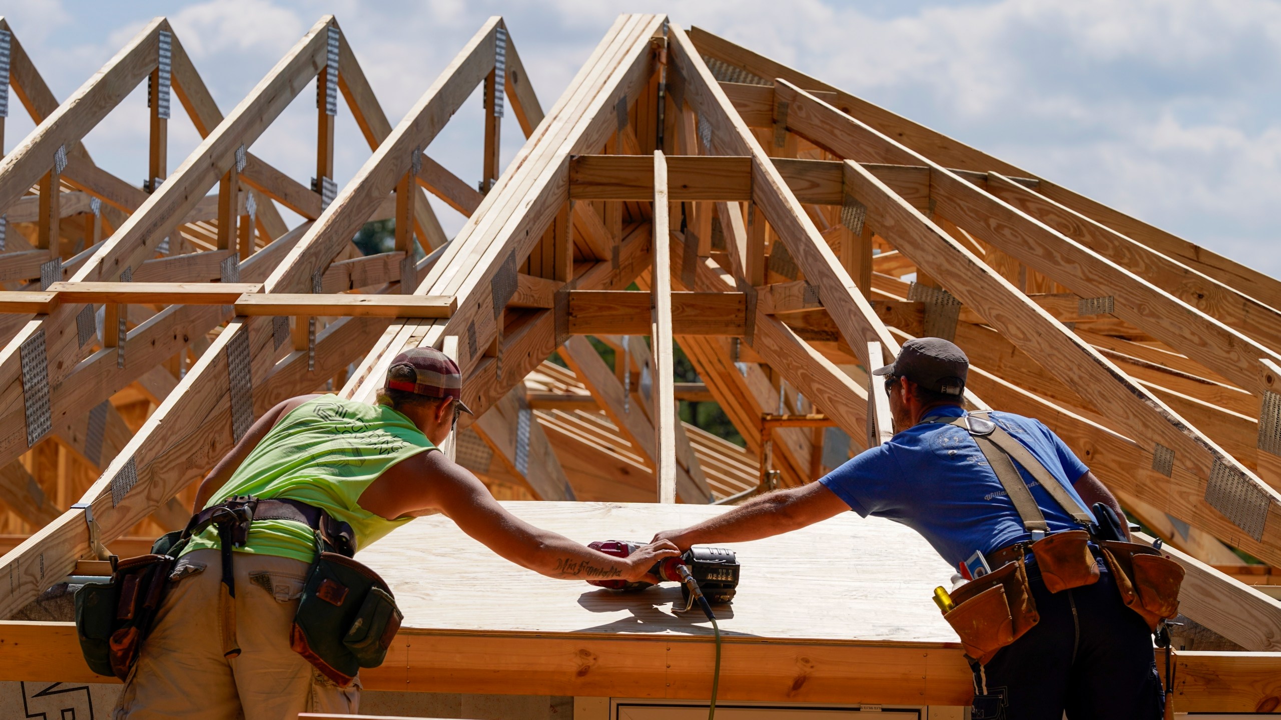 File - Carpenters work on a home on Sept. 19, 2023, in Marshall, N.C. On Thursday, May 30, 2024, Freddie Mac reports on this week's average U.S. mortgage rates. (AP Photo/Chris Carlson, File)