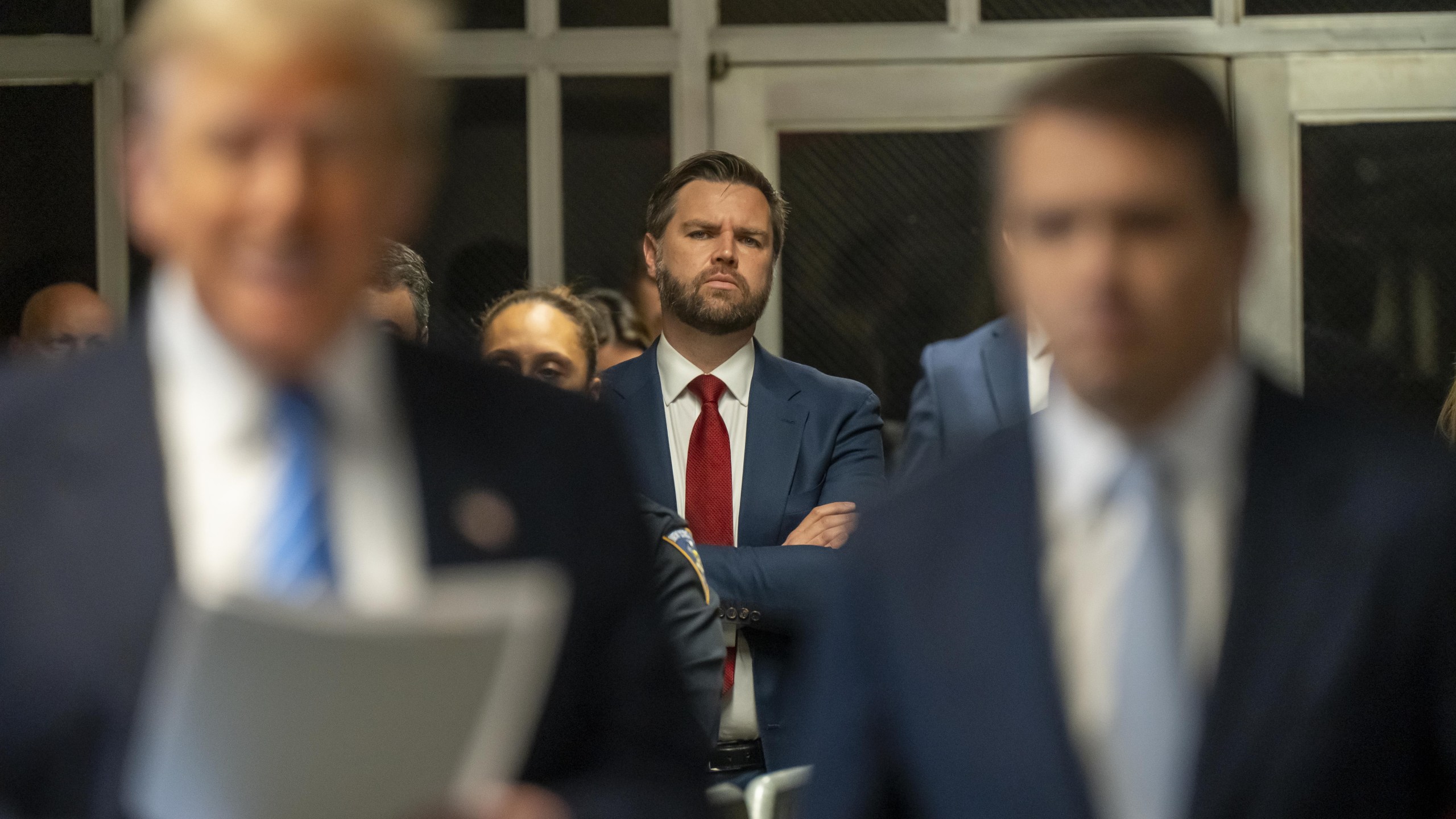 Senator JD Vance, a Republican from Ohio watches as Donald Trump speaks to the media at Manhattan criminal court May 13, 2024.