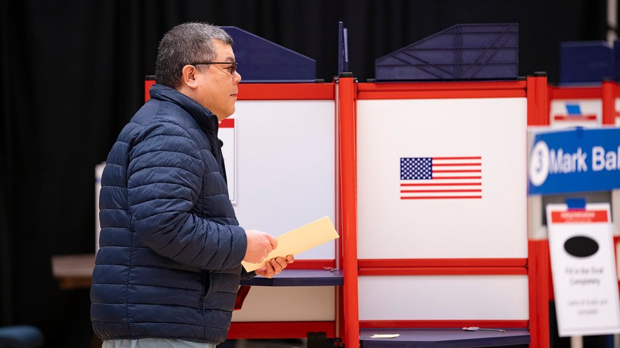 A voter fills out their ballot in Virginia on March 5