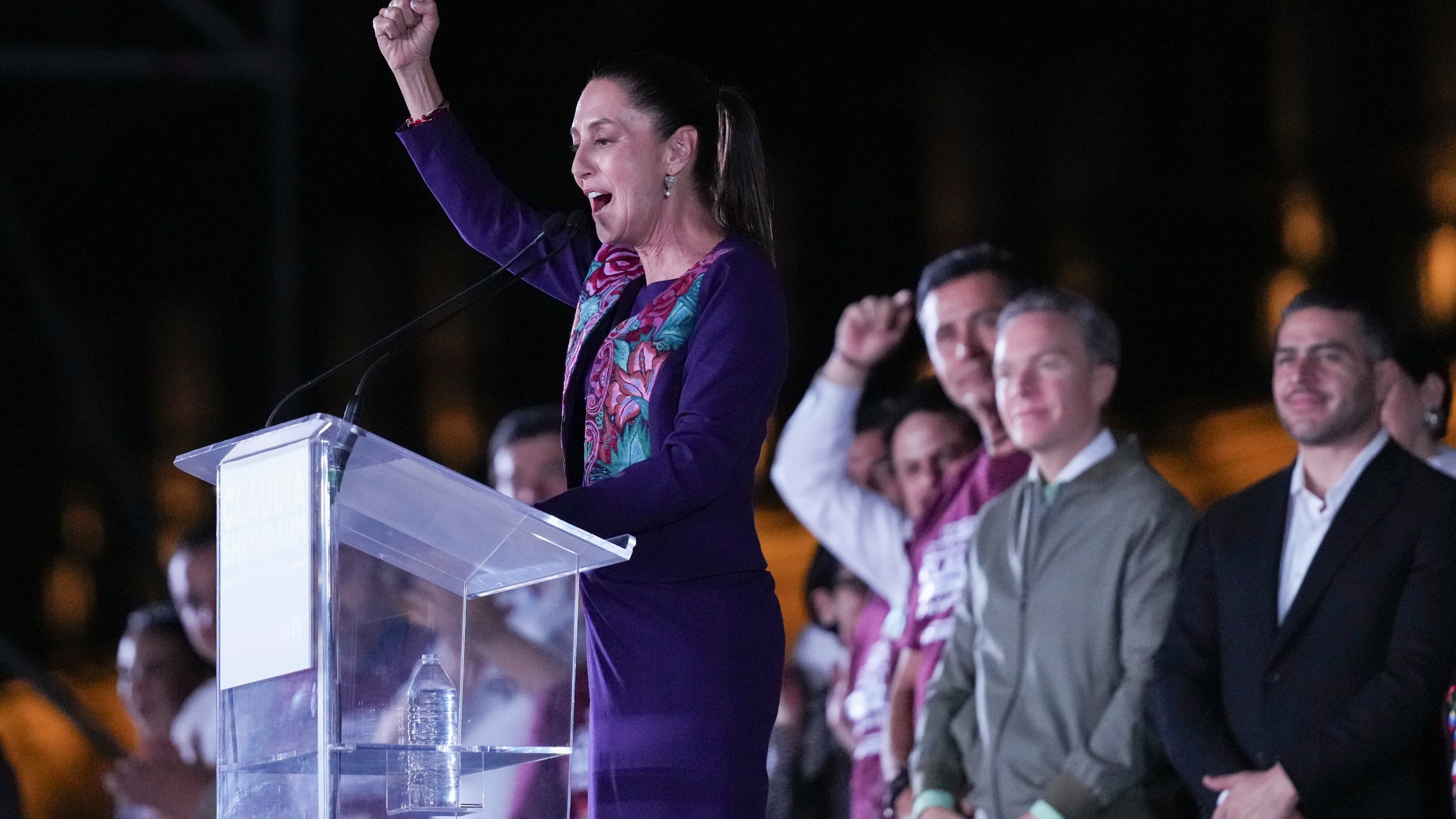 Ruling party presidential candidate Claudia Sheinbaum addresses supporters at the Zocalo, Mexico City's main square, after the National Electoral Institute announced she held an irreversible lead in the election, early Monday, June 3, 2024. (AP Photo/Marco Ugarte)