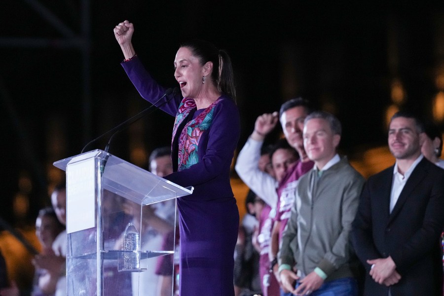 Ruling party presidential candidate Claudia Sheinbaum addresses supporters at the Zocalo, Mexico City's main square, after the National Electoral Institute announced she held an irreversible lead in the election, early Monday, June 3, 2024. (AP Photo/Marco Ugarte)