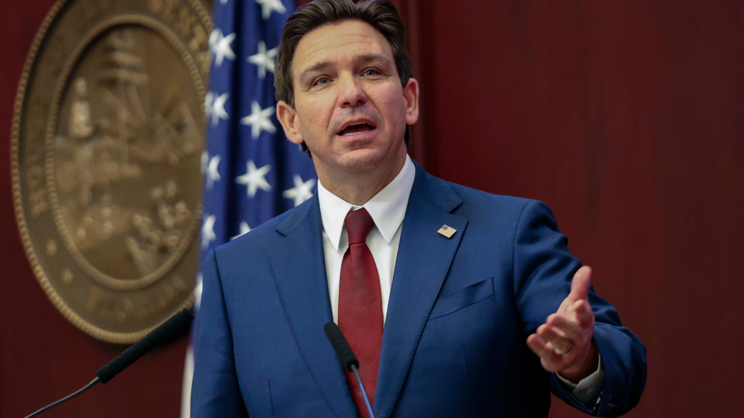 FILE - Florida Gov. Ron DeSantis gives his State of the State address during a joint session of the Senate and House of Representatives in Tallahassee, Fla., Jan. 9, 2024. Months after Disney DeSantis' appointees agreed to end a protracted legal fight, the two sides are set to approve an agreement Wednesday, June 5, that could result in the company investing $17 billion into its Florida resort and opens the door to a fifth major theme park at Walt Disney World. (AP Photo/Gary McCullough, File)