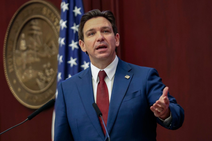 FILE - Florida Gov. Ron DeSantis gives his State of the State address during a joint session of the Senate and House of Representatives in Tallahassee, Fla., Jan. 9, 2024. Months after Disney DeSantis' appointees agreed to end a protracted legal fight, the two sides are set to approve an agreement Wednesday, June 5, that could result in the company investing $17 billion into its Florida resort and opens the door to a fifth major theme park at Walt Disney World. (AP Photo/Gary McCullough, File)