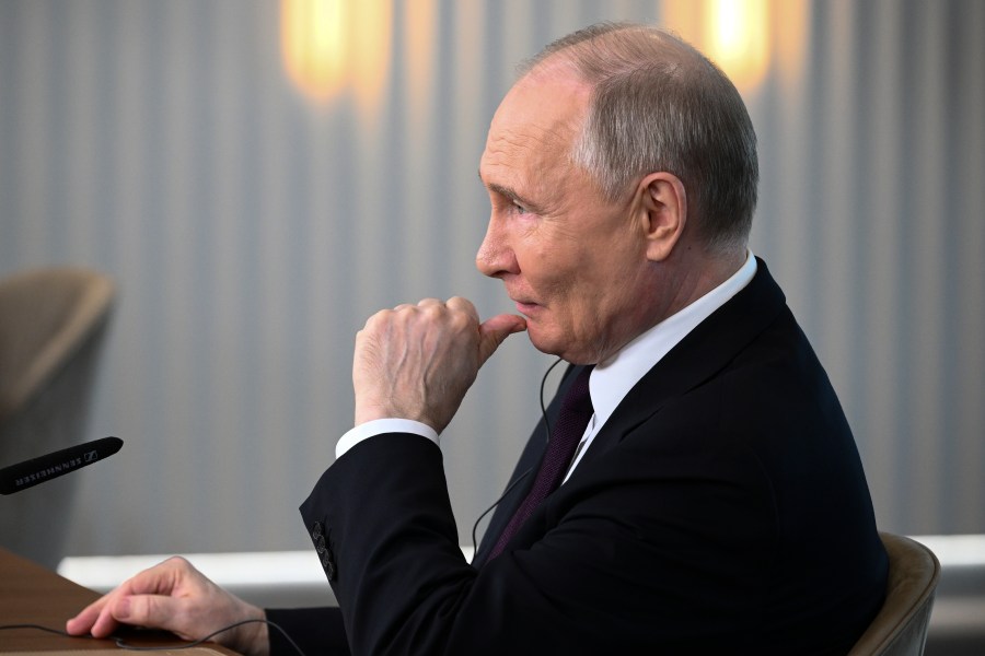 Russian President Vladimir Putin listens to a journalist's question as he meets with senior news leaders of international news agencies on the sidelines of the St. Petersburg International Economic Forum at the Lakhta Center skyscraper, the headquarters of Russian gas monopoly Gazprom in St. Petersburg, Russia, on Wednesday, June 5, 2024. (Vladimir Astapkovich, Sputnik, Kremlin Pool Photo via AP)