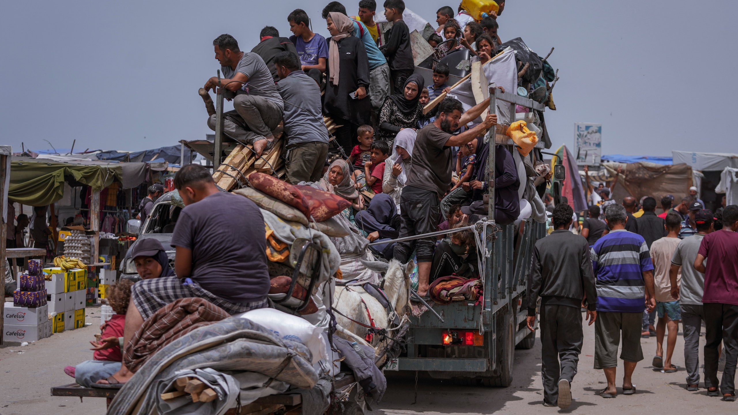 FILE - Palestinians fleeing from the southern Gaza city of Rafah during an Israeli ground and air offensive in the city on Tuesday, May 28, 2024. A single image, not even an authentic photograph, is the focus of a singular campaign on Instagram that has caught the attention of the algorithm and captured the imaginations of users across national borders — a show of support for the Palestinian movement as the war between Israel and Hamas enters its eighth month. (AP Photo/Abdel Kareem Hana, File)