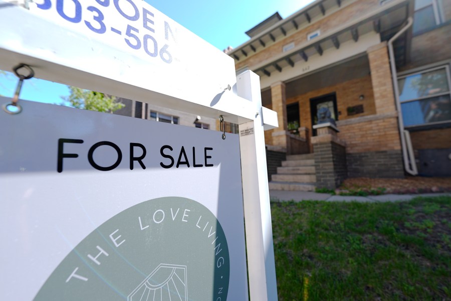 A sale sign stands outside a duplex on the market Friday, May 24, 2024, in downtown Denver. On Thursday, June 6, 2024, Freddie Mac reports on this week's average U.S. mortgage rates. (AP Photo/David Zalubowski)