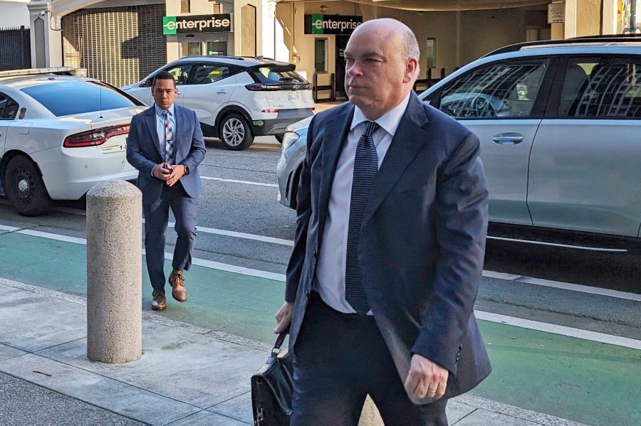 Former British tech star Mike Lynch walks into federal court in San Francisco.