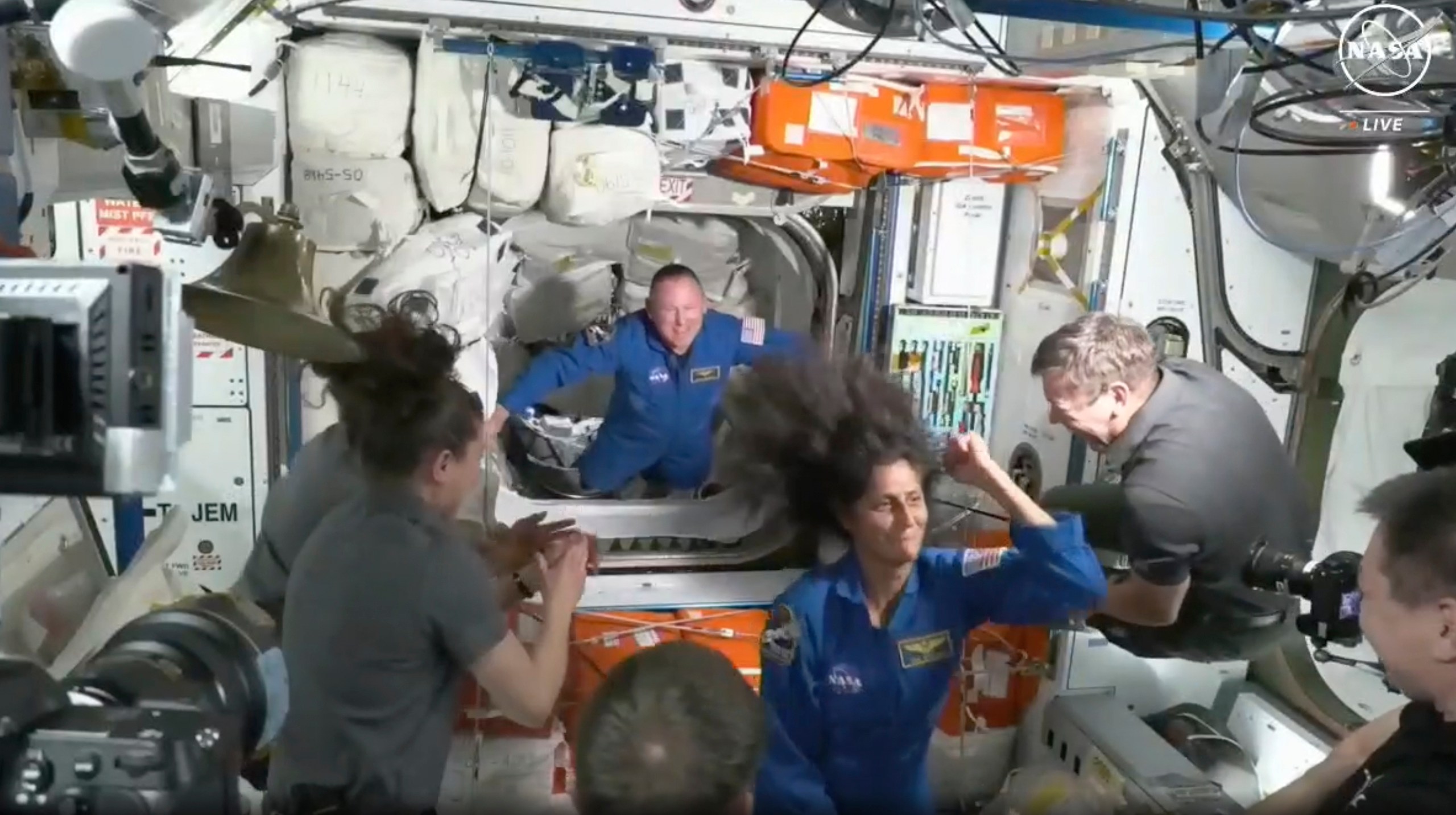 NASA astronauts Butch Wilmore and Suni Williams are greeted by the crew of the International Space Station on Thursday, June 6, 2024. (NASA via AP)