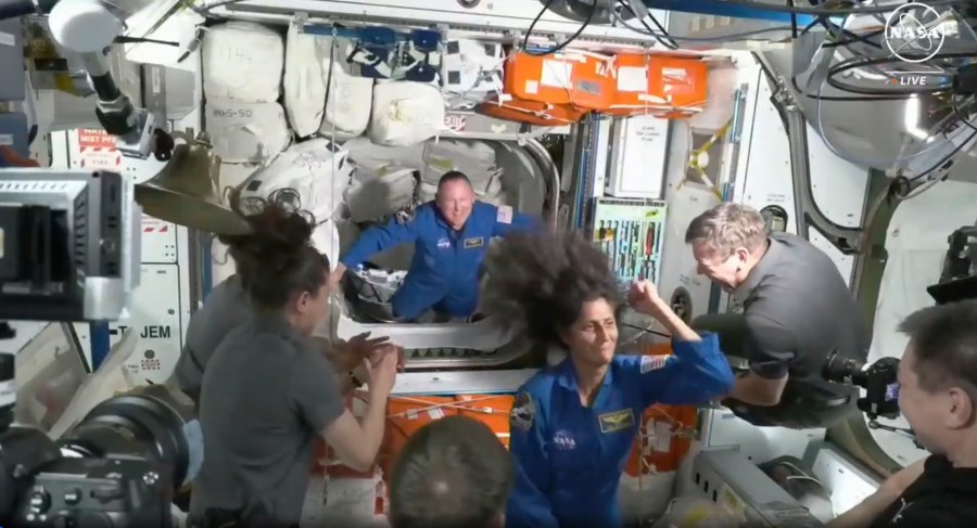 NASA astronauts Butch Wilmore and Suni Williams are greeted by the crew of the International Space Station on Thursday, June 6, 2024. (NASA via AP)