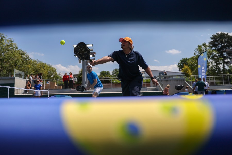 People play pickleball at the French Open tennis tournament at the Roland Garros stadium in Paris, Thursday, June 6, 2024. (AP Photo/Aurelien Morissard)